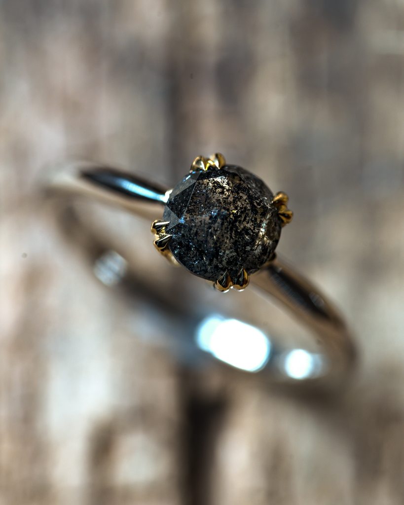 salt and pepper diamond ring in a double talon claw setting